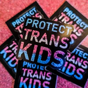 a group of stickers saying: "Protect Trans Kids"